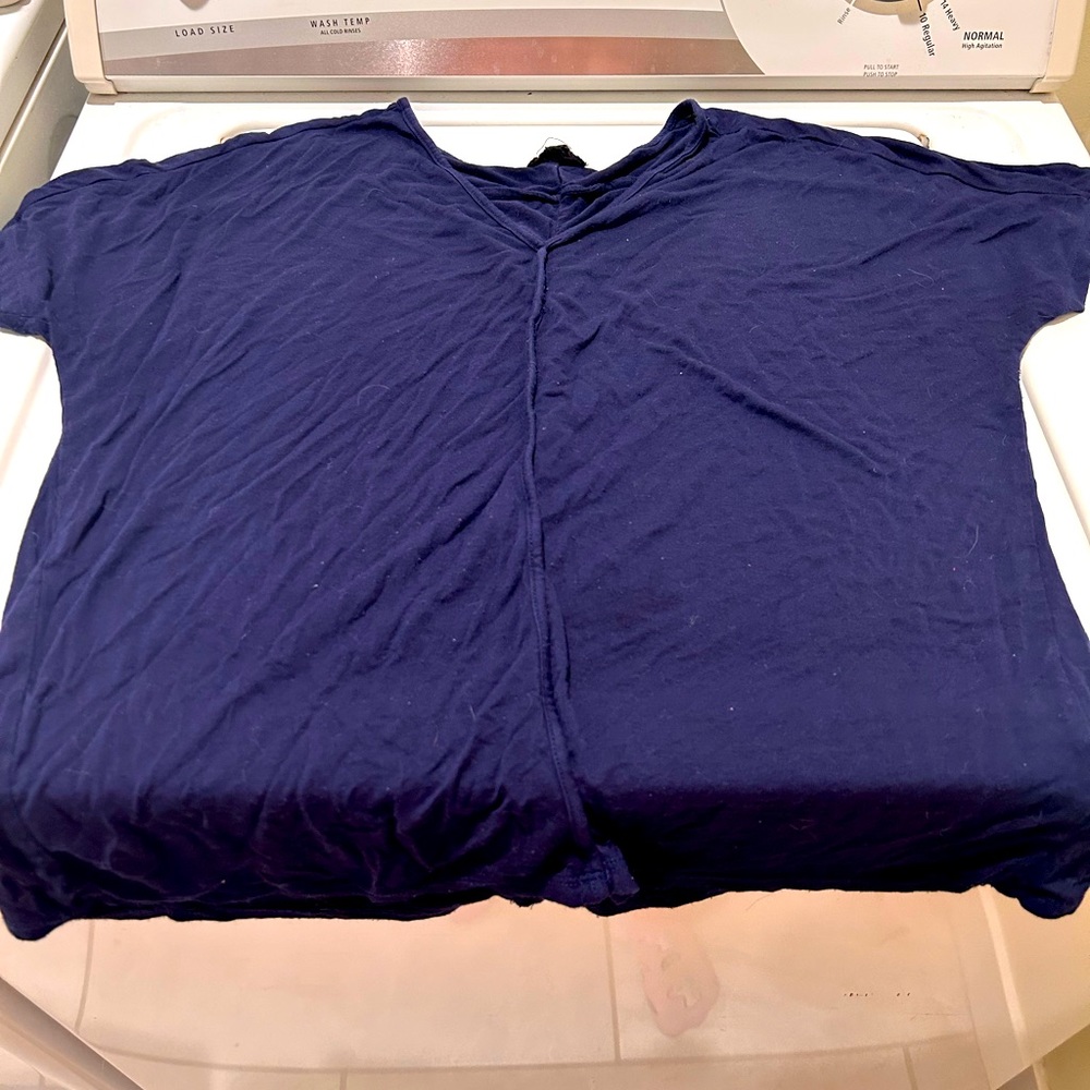 Blue woman’s t shirt by the brand Fate. It’s super soft